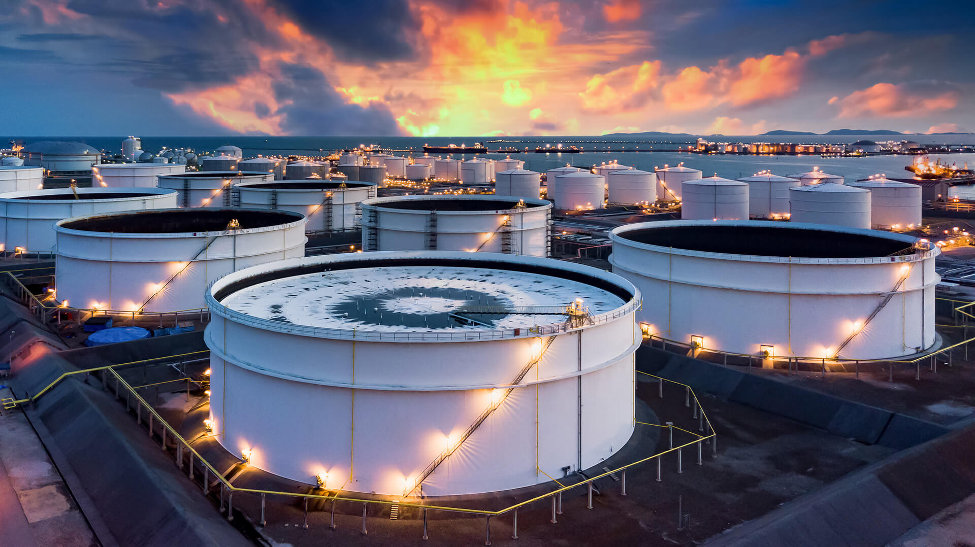 Product storage tanks at dusk